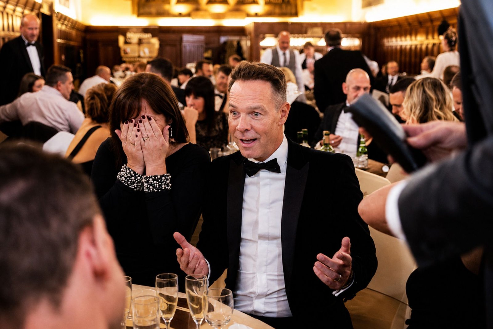 Table magician performing close-up magic at a London corporate dinner